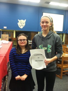 Rachel and a friend assisting with set up for teacher dinner.