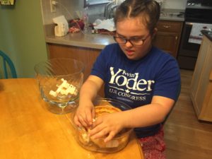 Rachel tearing the angel food cake into bite size pieces