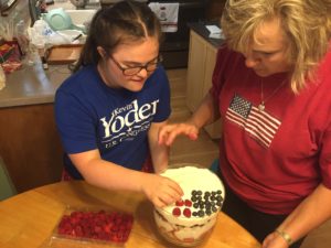 Top it off with cream filling and we made our flag with blueberry stars and raspberry stripes