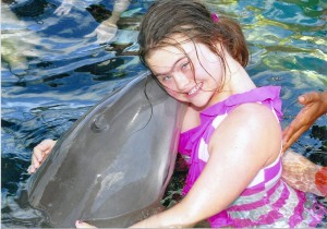 Disney Cruise swimming with the dolphins.  She said the dolphin's name was "Jawanda." 