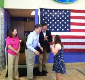 Shaking Gov. Brownback's hand. Pictured with Mrs. Brownback anad Sen. Santorum. 